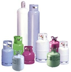 "Image of various air conditioning refrigerants, essential components in HVAC systems, including R-22, R-410A, R-32, and R-134a. These refrigerants are crucial for cooling efficiency and energy performance in residential and commercial air conditioning units. The photo shows cylinders of refrigerants used in air conditioners, highlighting the importance of refrigerant types in heat exchange processes. The transition from HCFCs to HFCs and the adoption of eco-friendly refrigerants like hydrofluoroolefins (HFOs) are depicted, emphasizing the industry's move towards reducing global warming potential (GWP). The image illustrates how refrigerants like R-22, with high ozone depletion potential (ODP), are being phased out in favor of environmentally sustainable alternatives. It showcases the critical role of refrigerants in maintaining optimal temperature control and the impact of refrigerant choice on energy efficiency and system longevity. The visual representation underscores the significance of proper refrigerant handling, recycling, and the need for trained HVAC technicians in refrigerant management. The image also hints at ongoing advancements in refrigerant technology, aiming to meet environmental regulations and improve the performance of air conditioning systems. By focusing on refrigerants like R-410A and R-32, which offer lower GWP and better thermodynamic properties, the image aligns with the industry's commitment to sustainability and innovation. The photo serves as a reminder of the necessity for regulatory compliance and the benefits of adopting next-generation refrigerants for both environmental protection and enhanced cooling performance. Additionally, the image highlights the new California regulations for refrigerants aimed at reducing HFC emissions. These regulations, set by the California Air Resources Board (CARB), mandate the reduction of high-GWP refrigerants in new air conditioning systems, promoting the use of low-GWP alternatives and accelerating the phase-down of environmentally harmful refrigerants. This comprehensive depiction of air conditioning refrigerants encapsulates their pivotal role in modern HVAC systems, energy conservation, adherence to California's stringent environmental regulations, and the global effort to mitigate climate change through responsible refrigerant usage and management