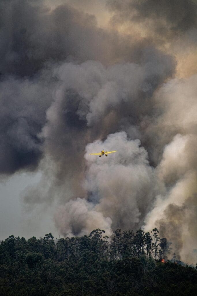 Dramatic scene of a plane battling a forest fire in Sever do Vouga, Portugal.