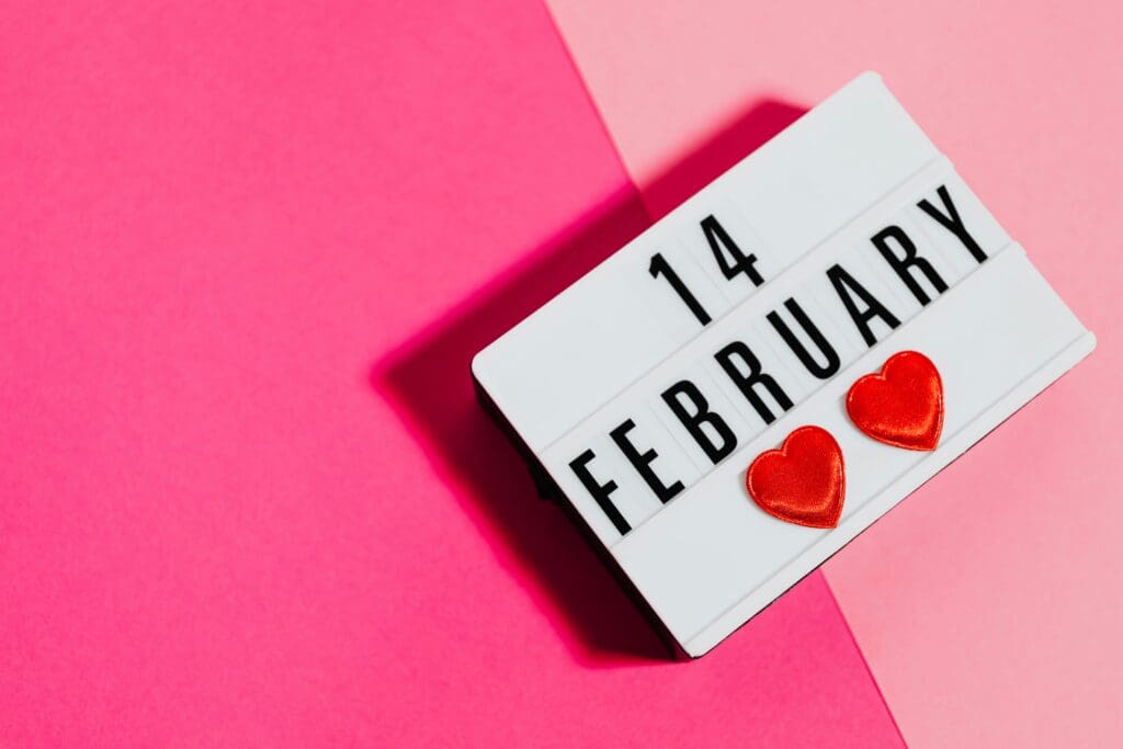 Lightbox display showing '14 February' with hearts on pink background.