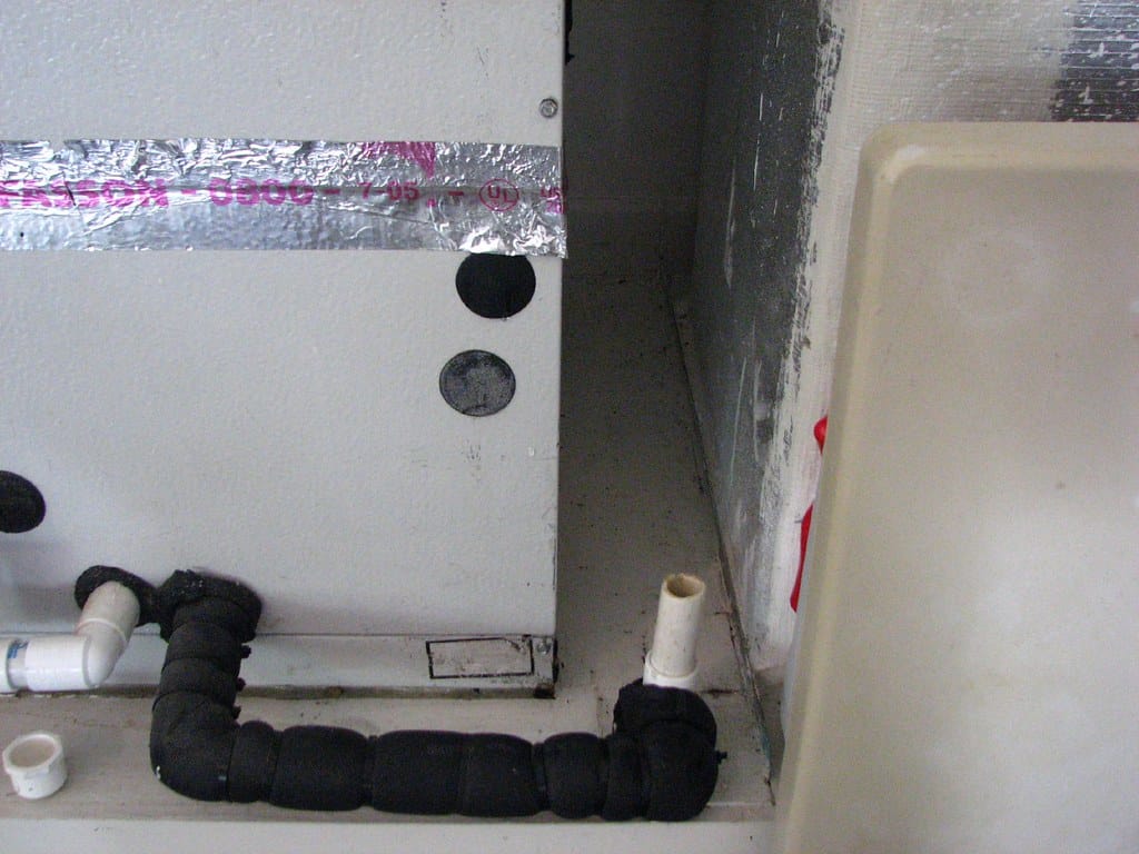 Air conditioner overflow causing water damage on July 2008 installation.